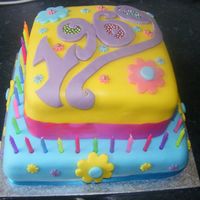 Newest_003.jpg 2 tier sponge cake decorated with fondant..flower power/1969 theme!