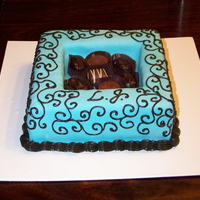 Candy Box Cake Chocolate cake covered in mmf with chocolates inside.