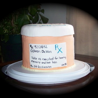 Prescription For A Happy Birthday This cake was made for a gentleman who turned 50. Chocolate cake with banana cream pie filling. Covered in MMF. The cover says "Senior...