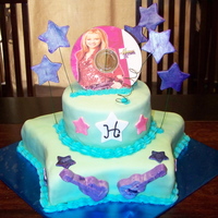 Another Hannah Montana Cake stars are gumpaste. Chocolate cake covered in MMF. Guitars are made from candy melts