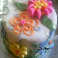 Flowers And Green Made this cake for a church auction, with matching cupcakes. All fondant. Vanilla WASC with cheesecake filling. What do you think? Its alot...