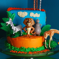 Madagascar Escape 2 Africa Cake A Madagascar movie themed cake I made for my son's 2nd birthday on February 19th. Homemade buttercream frosting over yellow cake. :)