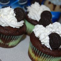 Mini Oreo Surprise Cupcakes Devils food cake w/ a mini oreo and cream cheese filling inside. Topped with cool whip and more mini oreos for an extra chocolately...