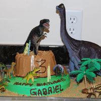 Dinosaur Mountain This is a two tier funfetti cake made for my son, Gabriel's 3rd Birthday today, June 18th. He is a true dinosaur fanatic so he was...