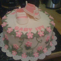 Welcome Baby Ivy White cake with vanilla buttercream covered in MM fondant. Baby converse, flowers and ivy leaves all MMF.