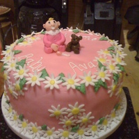 Daisies & Baby Vanilla cake with vanilla buttercream and strawberry filling. MMF covered. Daisies, baby, teddy and rattle made with fondant. Buttercream...