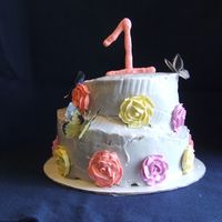 1St Birthday Cake This cake was made for my friends daughter for her first birthday. First time making a topsy turvy with buttercream. I think I'll...