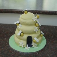 The Bees Knees My second attempt at fondant. Got the idea from Debbie Brown's Easy Party Cakes. I'm not sure about the easy part but it was fun...