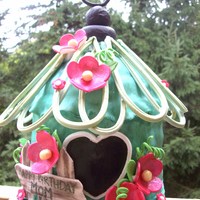Birdhouse Birthday Chocolate cake w/chocolate ganache and raspberry filling covered in fondant, hand painted with gumpaste accents.