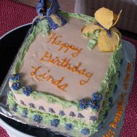 Iris Birthday Cake This is a lemon cake with lemon curd filling. It is covered with lemon BC and GP iris.