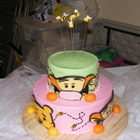 Peek A Boo Tigger Baby shower cake I did for church. This girl loves Tiggers, so I made him the main character. Tigger and Pooh made out of fondant...