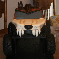 Taz Monster Truck Second attempt at a Monster truck. Chocolate buttercream icing with fondant accents. RKT covered in fondant for the wheels. TFL :)