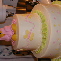 Pooh Shower Cake Iced in buttercream with fondant accents. First time doing ruffles. Needed two sets of hands:)