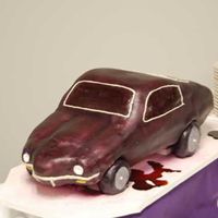 Kellys_Party_Cake.jpg The birthday girl for this cake turned 30 and drives a 1971 Camero muscle car. Her husband asked if I could put something under the car to...