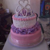 Tinas 1St B-Day I made this for my goddaughters 1st b-day. Yellow "doctored" cake with buttercreme. Bottom layer covered in MMF. Crown made with...