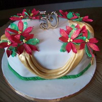 50Th Anniversary Cake pointsetta anniversary cake covered in Ivory fondant