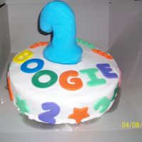First Birthday This cake was for a boy's first birthday. Mom just said something with bright colors and a big 1 on top, so this is what I designed....