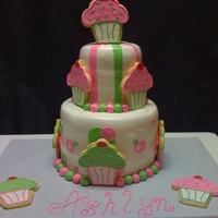 Cookies And Cake! My very very frustrating cake. I had an awesome bow at the top but the rain ruined it. ARGHH!!! The cupcakes are shortbread cookies covered...