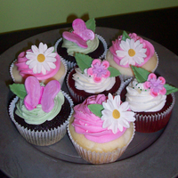 Baby Shower Cupcakes Cupcakes for a baby shower decorated with gumpaste flowers and butterflies. Buttercream frosting.