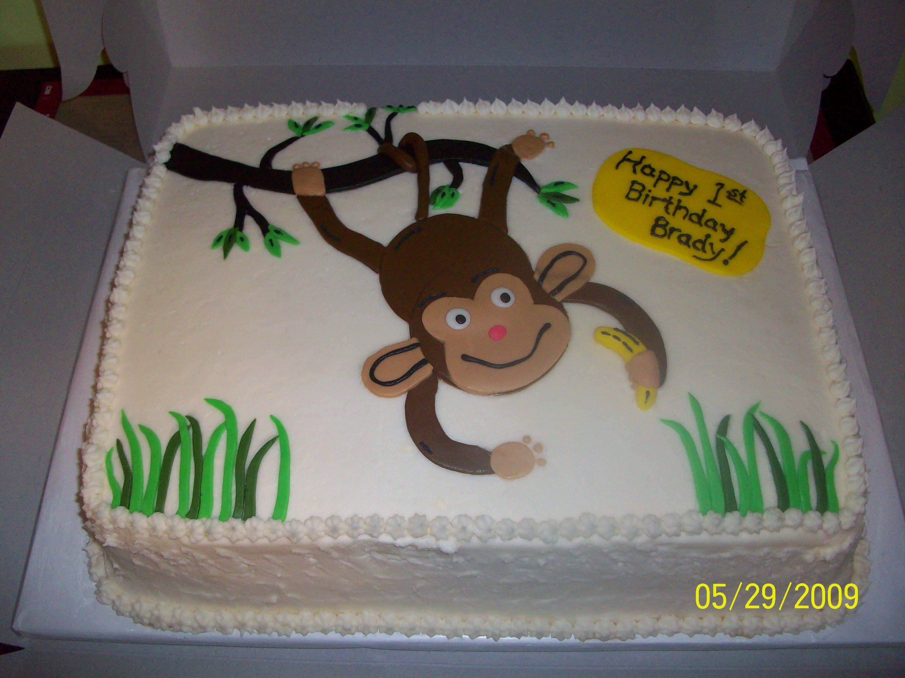 Monkey Birthday Cake Monkey Birthday cake with buttercream frosting and fondant decorations.