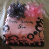 Pink & Black Birthday Cake Strawberry cake with strawberry mousse filling and strawberry flavored fondant. The bows were made using gelatine.