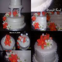 Class 3 Final 10" Round Chocolate & Stawberry and 6" Round White with Cookies and Cream filling, Covered in Fondant with Royal Icing Lilies...