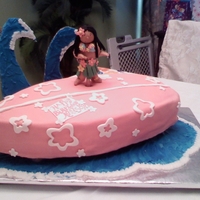 Surfer Cake This was made for my niece's seventh birthday. Almost everything is edible including the hula girl. The waves are royal icing on...