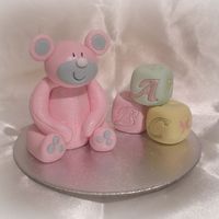 Pink Teddy With Hand Painted Building Blocks Well its modelling week at college and i'm doing a cake with a baby theme, we have to include embossing and painting into the theme on...