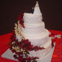 Congrats Tonia And Bill Made this 4 tiered cake for our Pastor's wife's brother. 14" was white cake with strawberry filling 12" was choc cake...