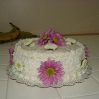 Mom's Birthday Cake 1/26/09 Coconut cake with fresh flowers