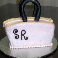 Pretty Pink Purse Chocolate Cake with MMF and a Gumpaste Handle painted with vodka & gel color.