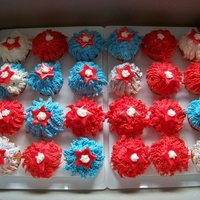 4Th Of July Cupcakes French vanilla cupcakes, filled with vanilla buttercream, covered in buttercream, red fondant stars and royal icing stars.