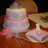 Pink Princess This princess cake is covered in buttercream with fondant accents. My first try at a pillow and shoe. I was pretty happy with the way they...