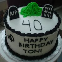 Over The Hill It's the BIG one! 40th birthday cake made from white cake and butercream frosting. The tombstones are made from fondant.