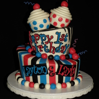 Twins First Birthday A 9", 6" topsy turvy with 2 fondant covered cupcakes on top. Thanks for looking!!