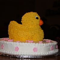 Ducky Baby shower cake made for my friend's sister. The theme was rubber ducks and pink so this is what I came up with. The duck is white...