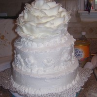 Rose Cake i seen a pic on movie that whole cake was done like a rose after top tier the petals wouldnt stay on maby next time, it was fun any way