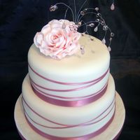 Pink Ribbon And Rose With Bead Topper This was a birthday cake for my nans 90th, 1 x 8 inch madeira cake and 1 x 6 inch chocolate cake, with gumpaste rose (that was missing a...