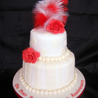 Ruby Wedding Cake This was a cake made for a friend of mines parents celebrating 40 years together, it is a 9 and 6 inch cake with gumpaste roses and a...