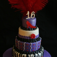 Sweet Sixteen Cake Fashion themed Sweet 16 Cake. All fondant decorations, and real feather topper.