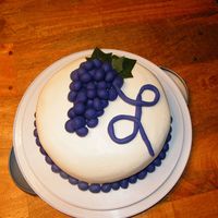 Grape Birthday Cake Buttercream with fondant grapes and "L"Made for my mom's bday (she collects grape things.) First try using fondant... it is...