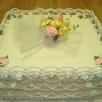 Int_Cake_Dec_Class_2A.jpg My first attempt at doing string work on a cake. Took a LOT of patience and a REALLY steady hand. The string work was all done with royal...