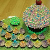 Charlotte_6Th_B-Day_2008_14A.jpg Made this for a friend's daughter's 6th birthday. I used the Giant Cupcake pan from Wilton. The giant cupcake is decorated with...