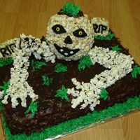 Dsc01363A.jpg Made this for a women's shelter I do volunteer baking for. It got lots of smiles. Skeleton was made from popcorn and oreo crumbs...