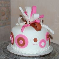 Fun Cake I made this cake to practice my fondant work . Its a vanilla 6" cake with buttercream layers and MMF cutouts and bow.