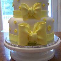 Yellow Wedding Shower Cake This is a champagne cake with MMf and gum paste bows. My first time making these. TFL!