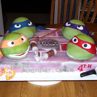 Turtles A little boy really wanted a cake with the Ninja Turtles. This cake is covered in butter cream and airbrushed. The turtle heads are made...
