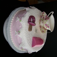 Tea Time Tea cup is hand painted and made out of Gum Paste. The shower was given at our local Tea Shop. The mother to be loved tea. The date on the...