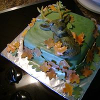 2-D Deer Head This photo is of a cake for my dad's birthday party, tomorrow. Everything is made of fondant and the leaves were coated with bronze...