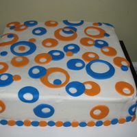 Blue And Orange Modern Circles 12" square cake doctored yellow mix with chocolate filling. This was a practice cake for hubby to take into work.